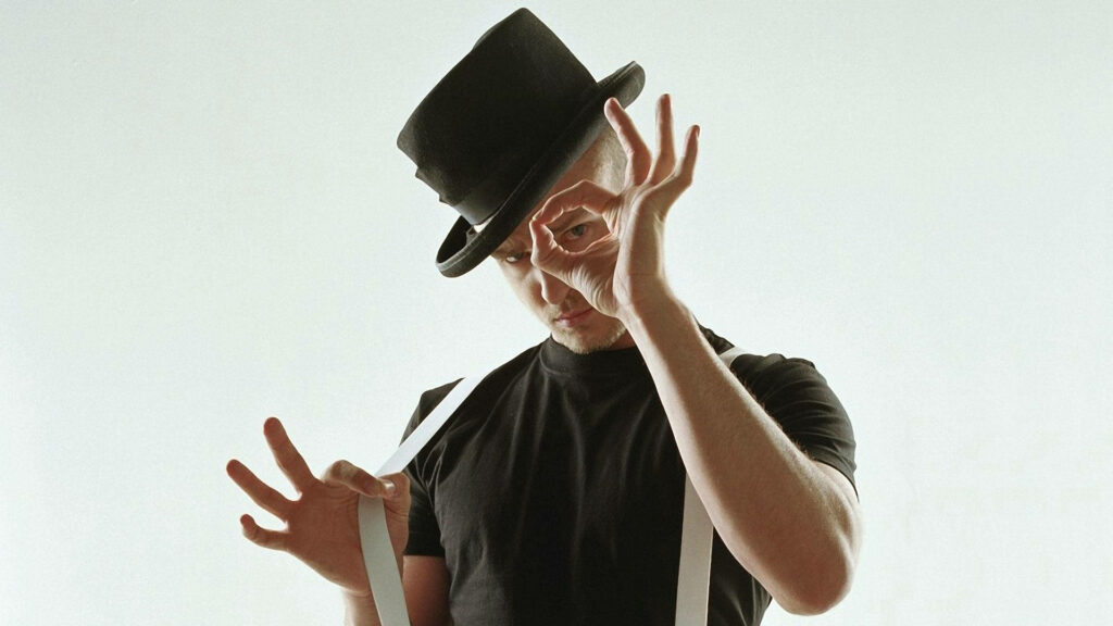 Stylish Justin Timberlake Wallpaper: Black Outfit & Expressive Pose