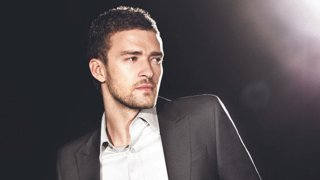 Stylish Wallpaper of Justin Timberlake in a Sleek Suit - Charismatic Look
