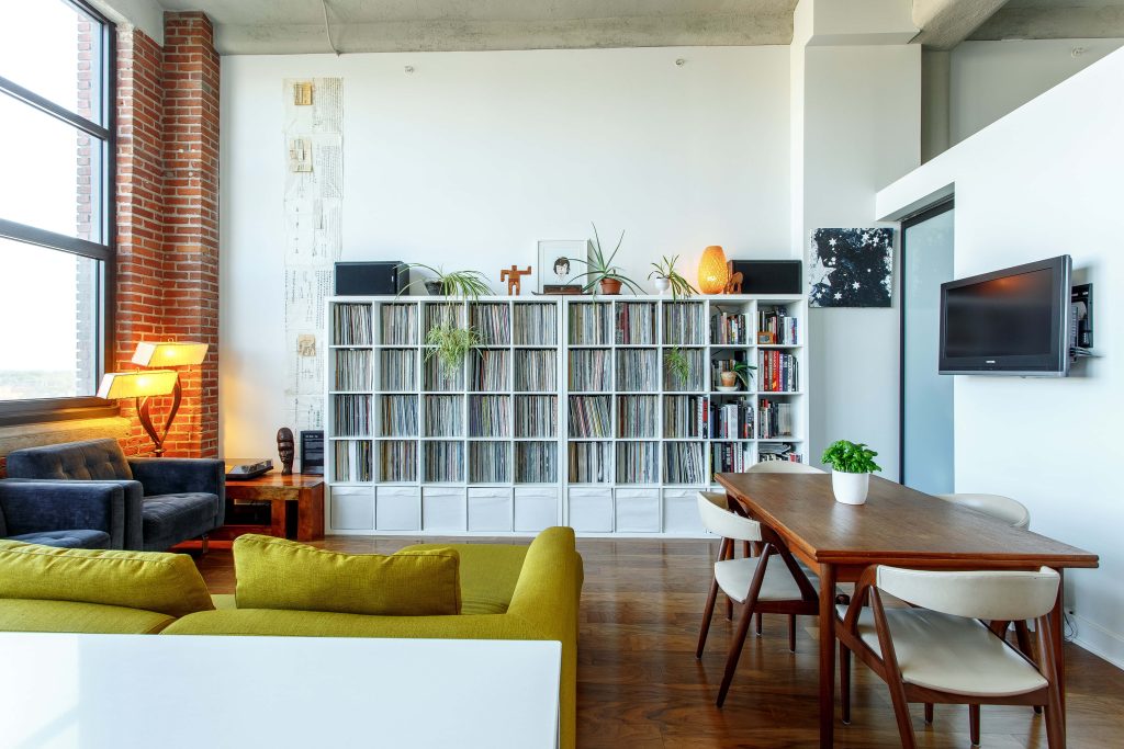 Zoom virtual background stylish loft living room vinyl records exposed brick warm lighting Wallpaper