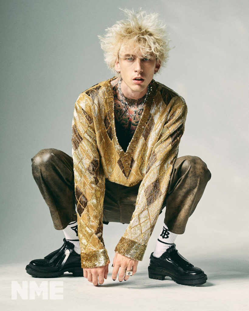 Machine Gun Kelly's Bold Gold Fashion: Stylish Outfit Wallpaper