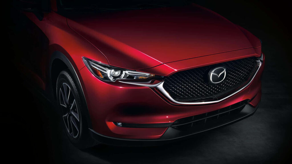 Stylish Mazda CX-5 Wallpaper: Bold Grille & Dynamic Red Finish
