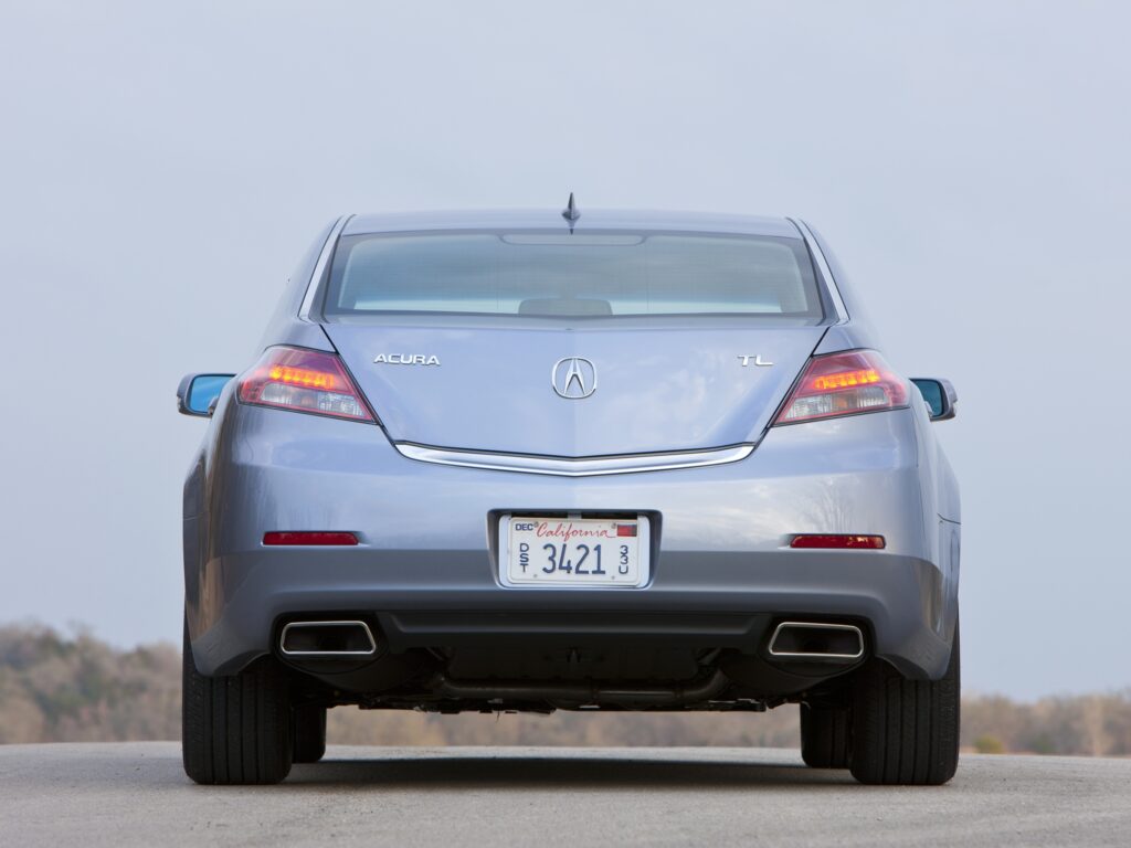 Sleek Metallic Blue 2011 Acura TL Rear View Against Clear Sky Wallpaper