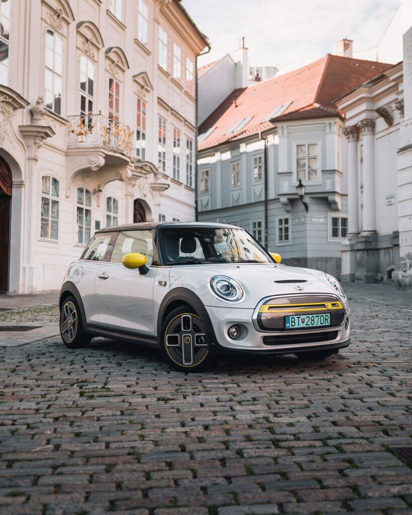 Stylish Mini Cooper S on Elegant Cobblestone Street – Classic Charm Wallpaper