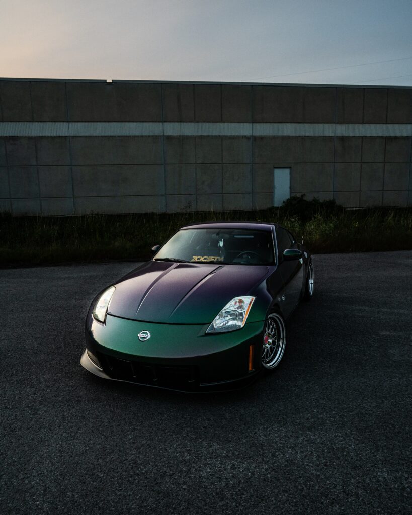 Front View Nissan Sports Car Wallpaper: Stylish Design & Urban Vibe