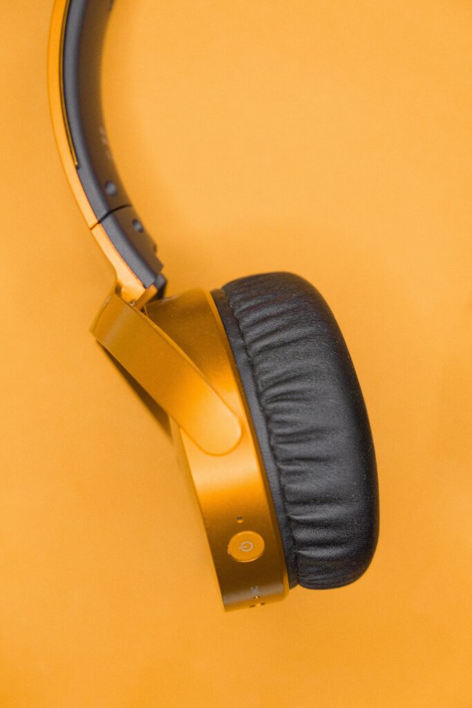 Stylish Orange Headphones Wallpaper for Music & Tech Lovers