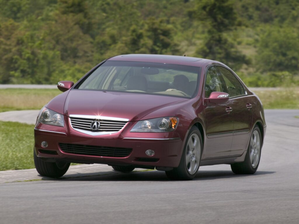 2004 Acura RL Front View on Track with Trees & Grass Background Wallpaper