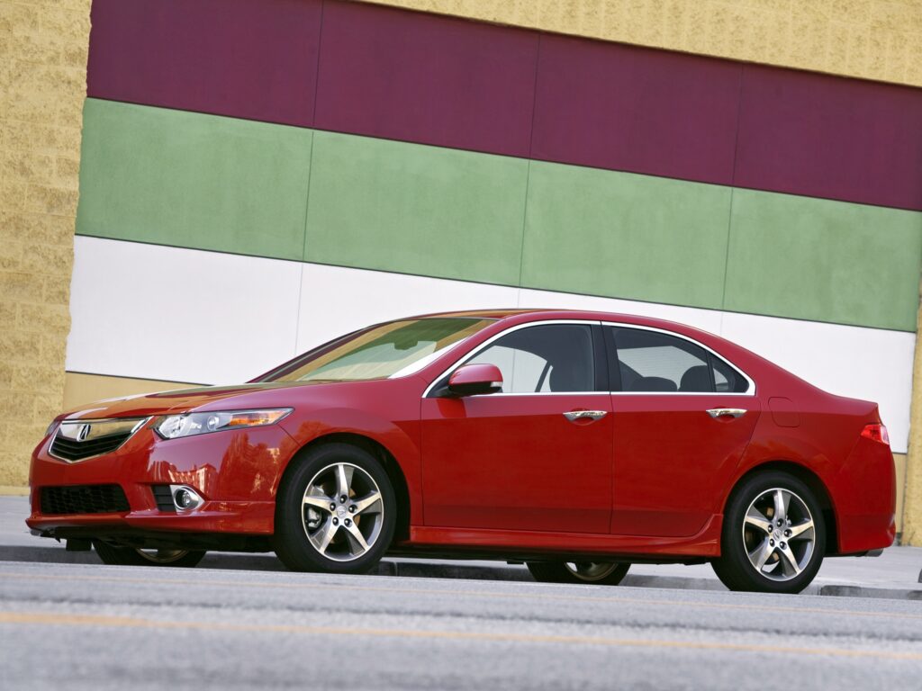 Stylish Red 2011 Acura TSX Side View Wallpaper with Colorful Background