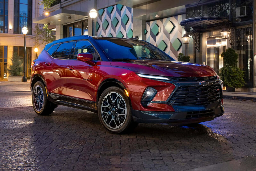 Stylish Chevrolet SUV Wallpaper: Urban Evening Setting in Red