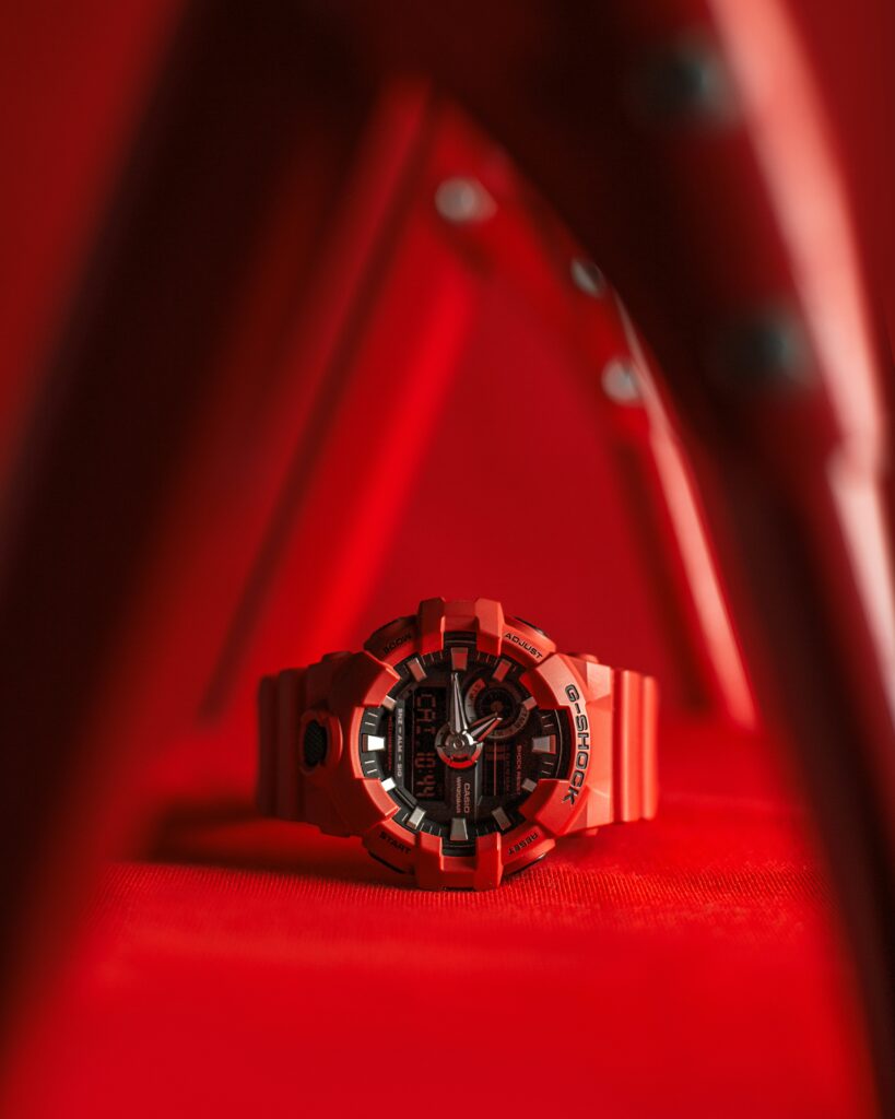Stylish Red Wristwatch Wallpaper: Bold Modern Design Background