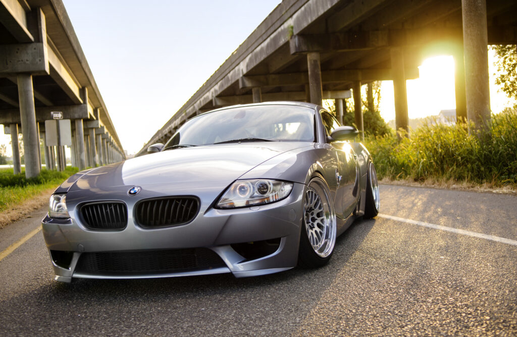 Sleek Silver BMW Z4 Front View on Scenic Road - Stylish Wallpaper