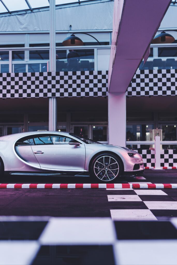 Sleek Silver Bugatti Chiron Side View in Stylish Modern Setting Wallpaper