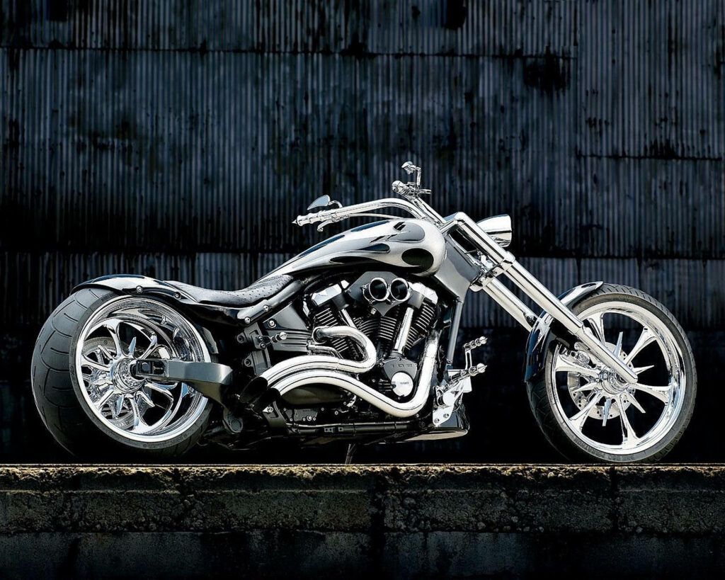 Stylish Silver Chopper Motorcycle Wallpaper Against Rugged Backdrop