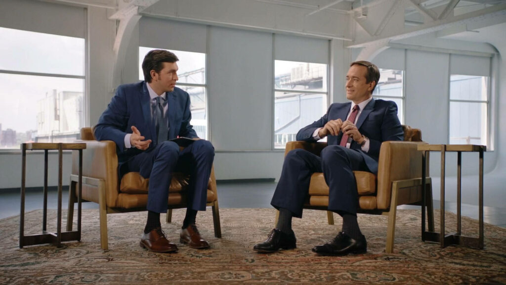 Succession Wallpaper: Greg & Tom in Engaging Interview Scene