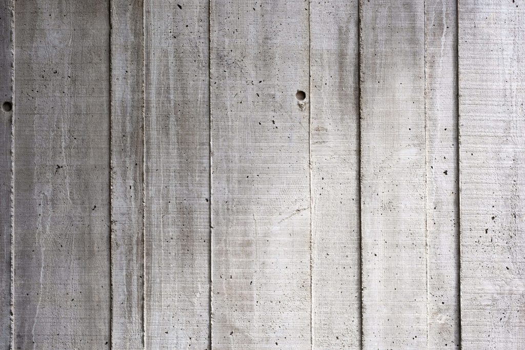 Urban concrete wall background with board-formed texture and clean vertical lines minimalist design Wallpaper