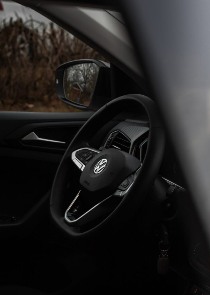 Close-Up of Sophisticated Volkswagen Car Interior with Iconic Steering Wheel Wallpaper