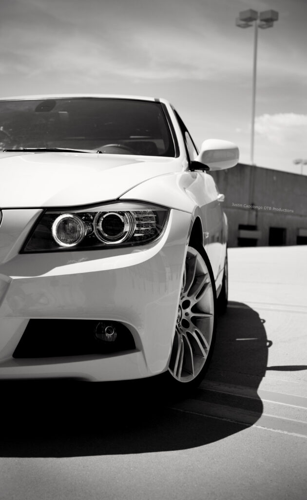 Sleek White BMW 328i Front View - Urban Sophistication Wallpaper