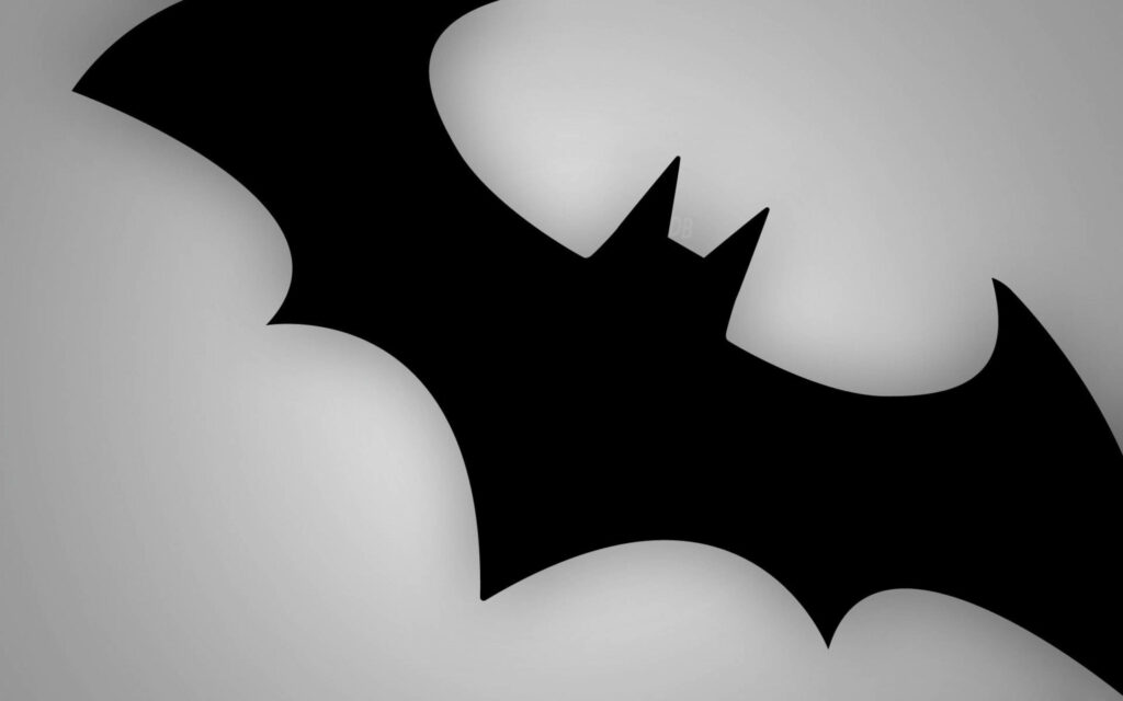 White Knight: The Sleek and Minimalistic Batman Logo Wallpaper Against a Graduated White-Grey Monitor Background