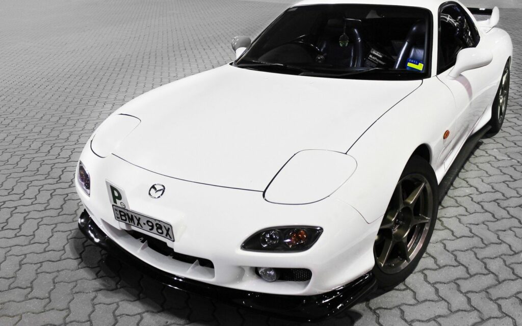 Stylish White Mazda Sports Car Wallpaper: Tuning & Aerodynamic Design