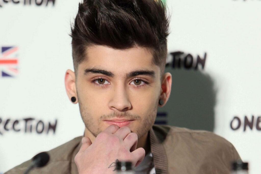 Zayn Malik Stylish Wallpaper: Iconic Look & Thoughtful Expression