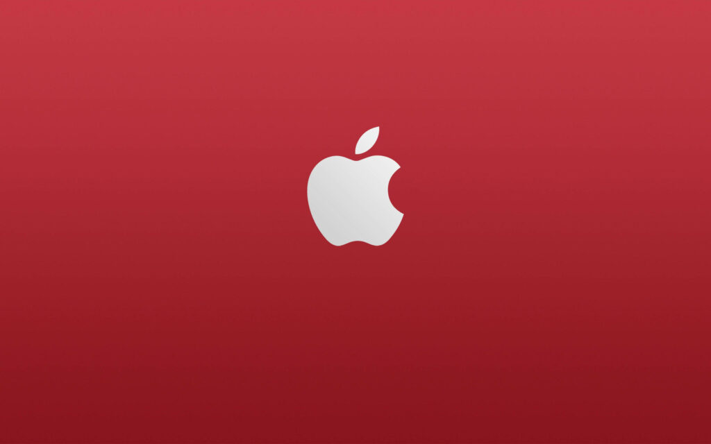 Minimalist wallpaper with white Apple logo centered on vibrant red background for tech fans
