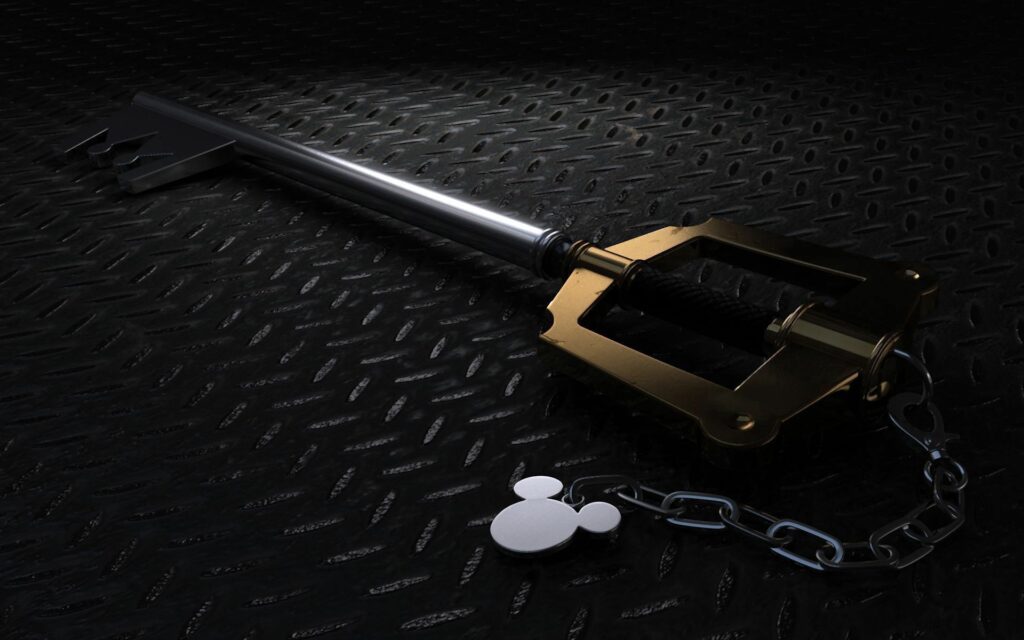 Stylized Metallic Key with Cartoon Pendant on Textured Surface Image Wallpaper