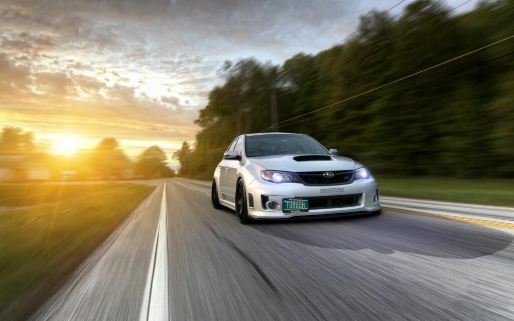 Subaru Impreza WRX in Motion: Scenic Sunset Wallpaper