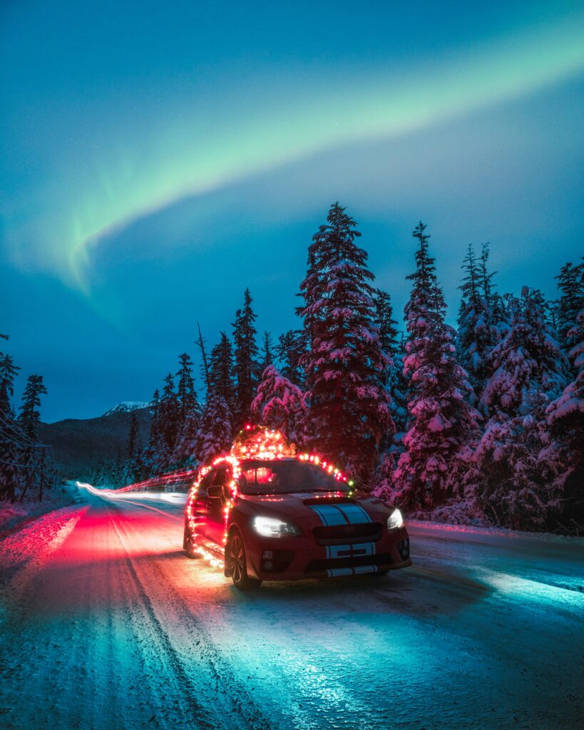 Subaru STI in Colorful Garlands Under Northern Lights: Winter Scenic Wallpaper