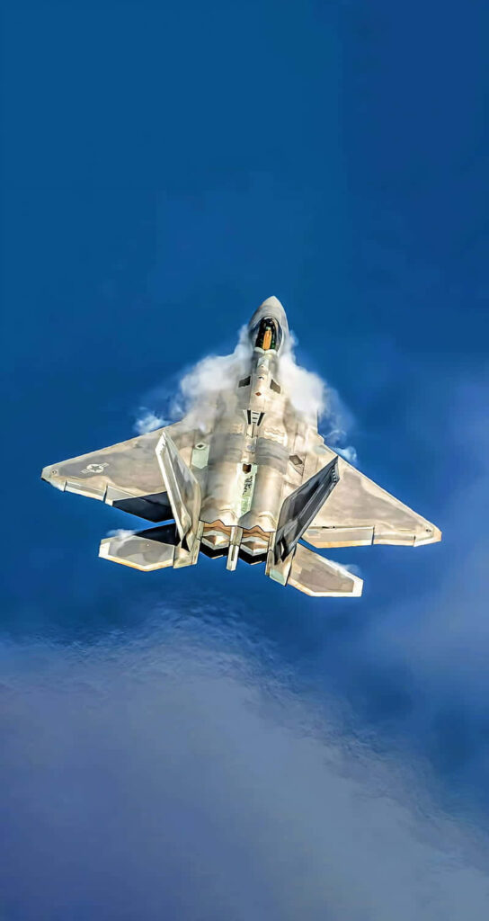 Sky's the Limit: Stunning F-22 Raptor in Action Surpasses Expectations, Soaring over the Majestic Blue Ocean Wallpaper