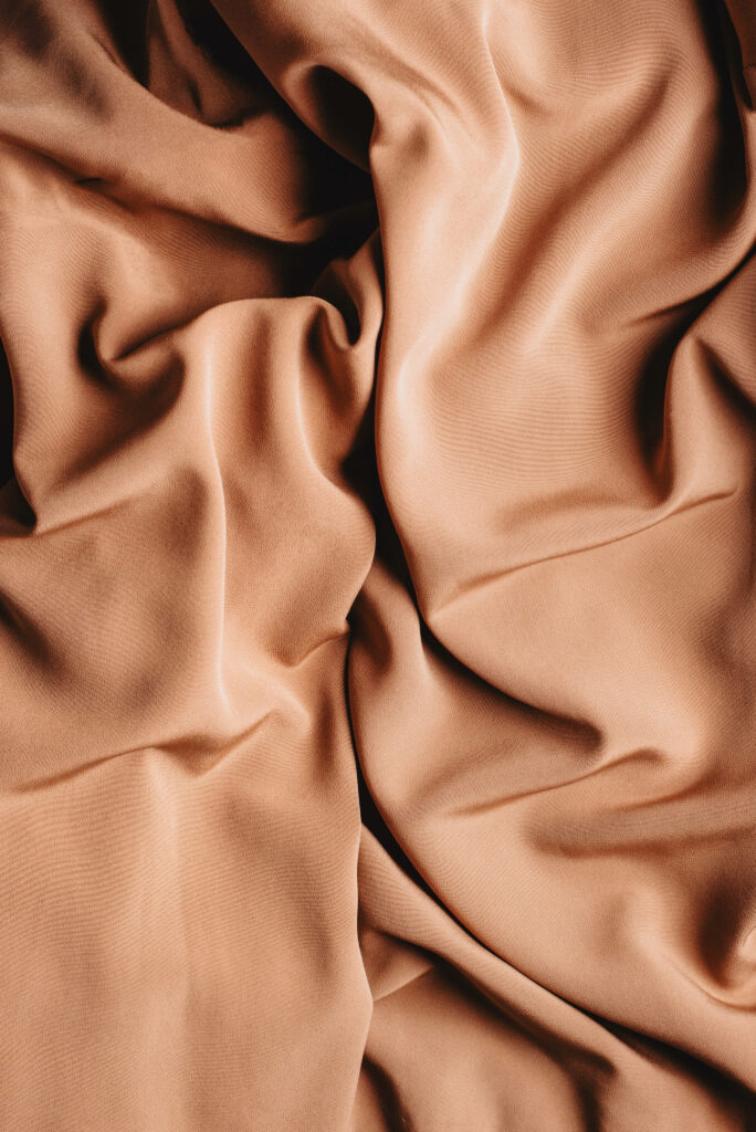 Magnificent Brown Silk: Embracing the Alluring Simplicity of Solid Pastel Color Wallpaper