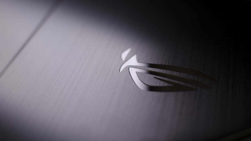Grey Elegance: Unveiling the Stunning Asus ROG Logo on Metal Surface Wallpaper
