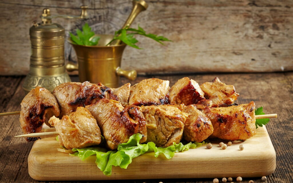 Sizzling Delights: Exploring the Tempting World of Savory Kebabs and Roast Pork Wallpaper