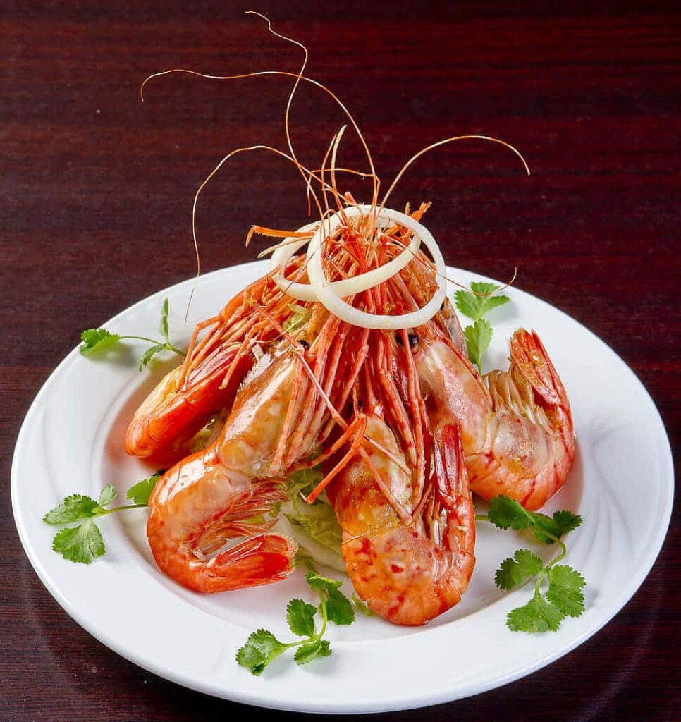 Stunning Shrimp Pyramid with Onion Rings & Cilantro - Wallpaper Background