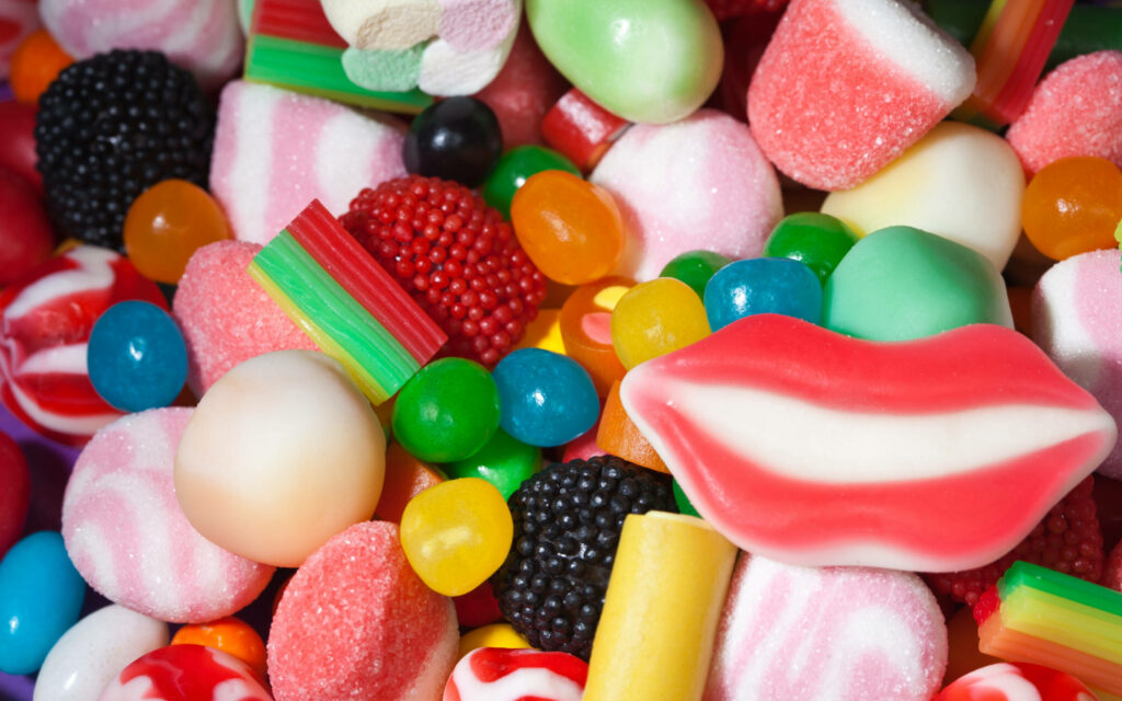 Sugar Paradise: Delightful Assortment of Colorful and Artistic Candy Masterpieces Wallpaper