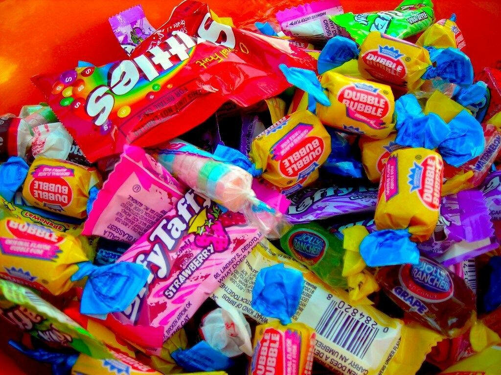 Sugary Delights: A Kaleidoscope of Kids' Candy Stash in Vibrant Kidcore Display Wallpaper