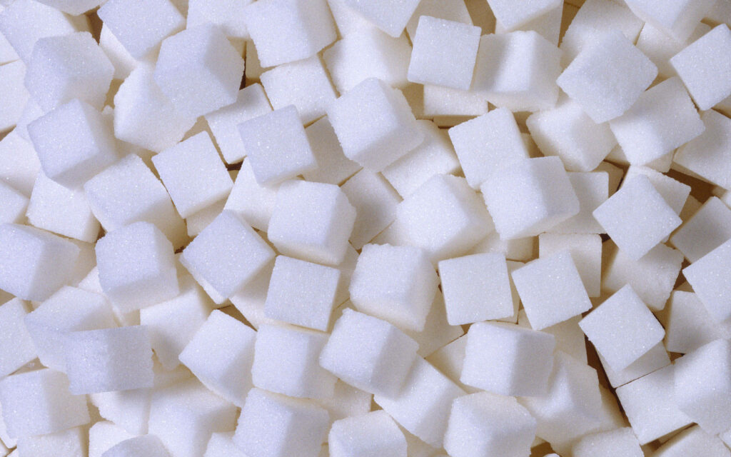 Sweet Delight: Aesthetic Wallpaper of a Heap of Sugar Cubes.