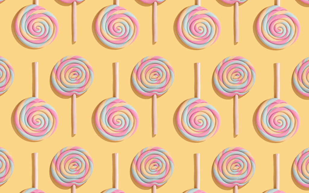 Sugary Delights: A Vibrant QHD Wallpaper of Tempting Candy and Lollipops