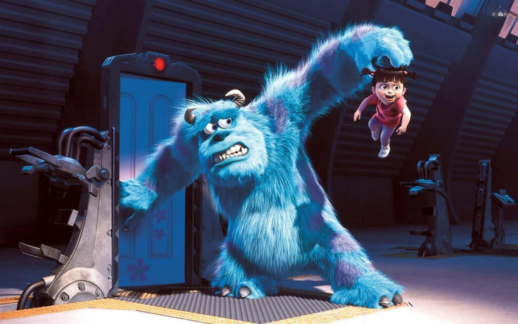 Fun Moments: Sulley Holds Boo with Mike in Monsters Inc. Wallpaper