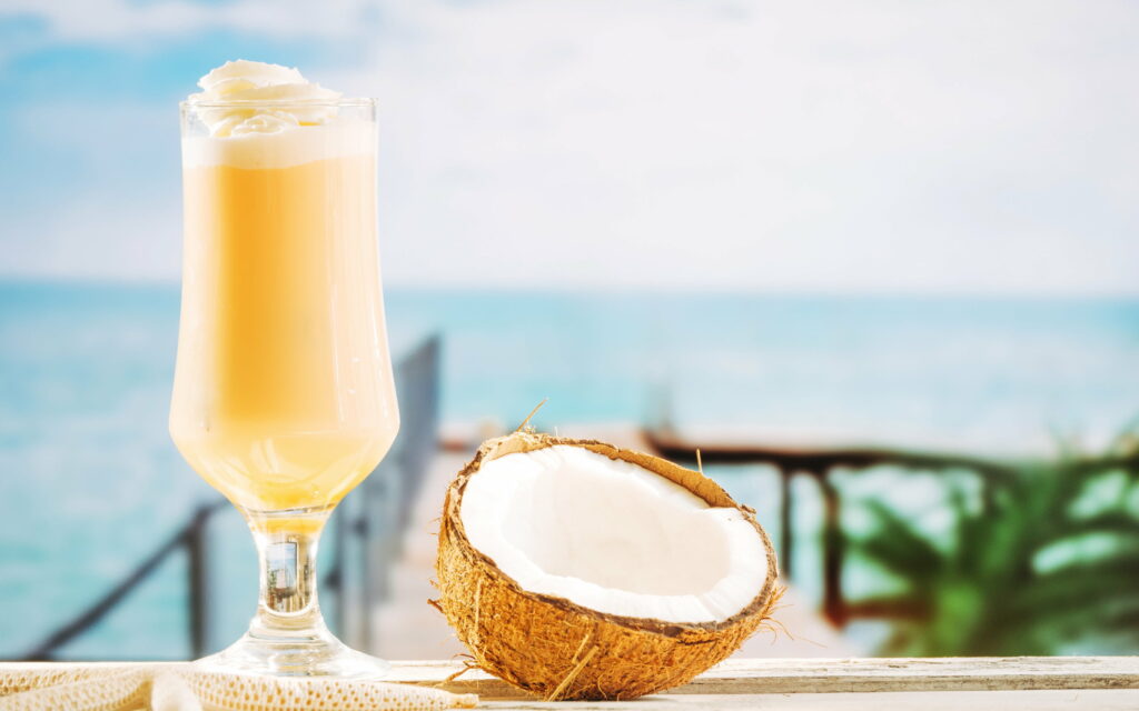 Beach Bliss: Sipping on the Tropical Symphony of Pina Colada by Coconut Bay Wallpaper