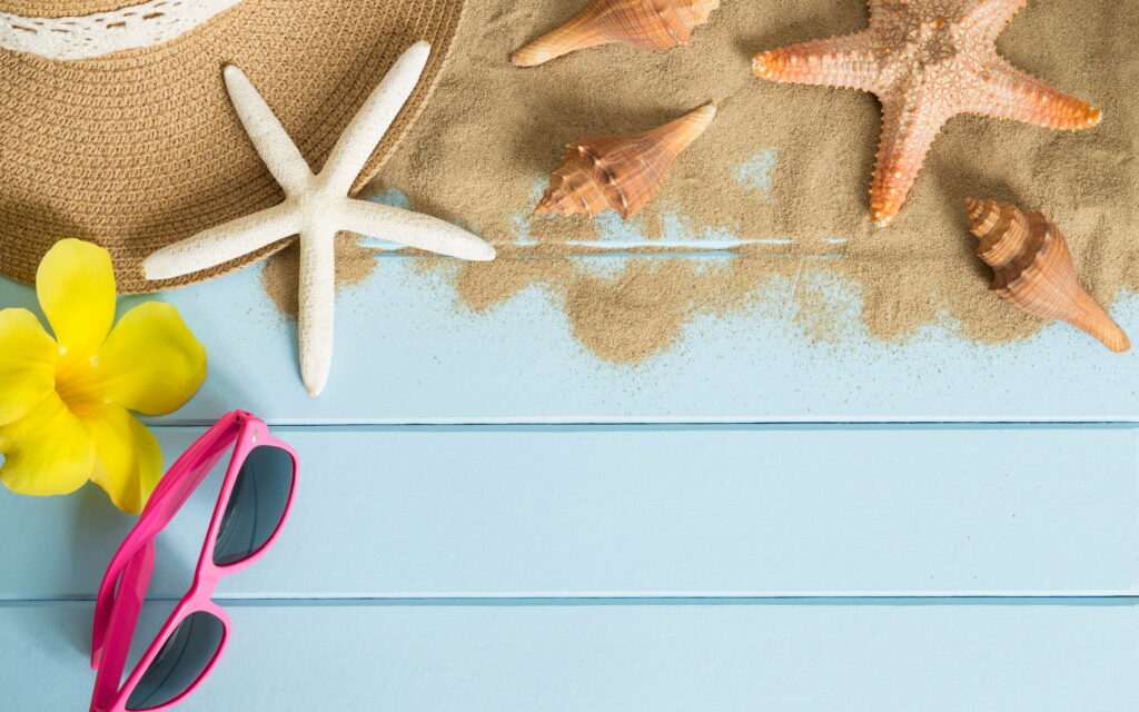 Sunny Shoreline Essentials: Starfish, Hat, and Sunglasses for a Stunning Summer Beach Adventure Wallpaper
