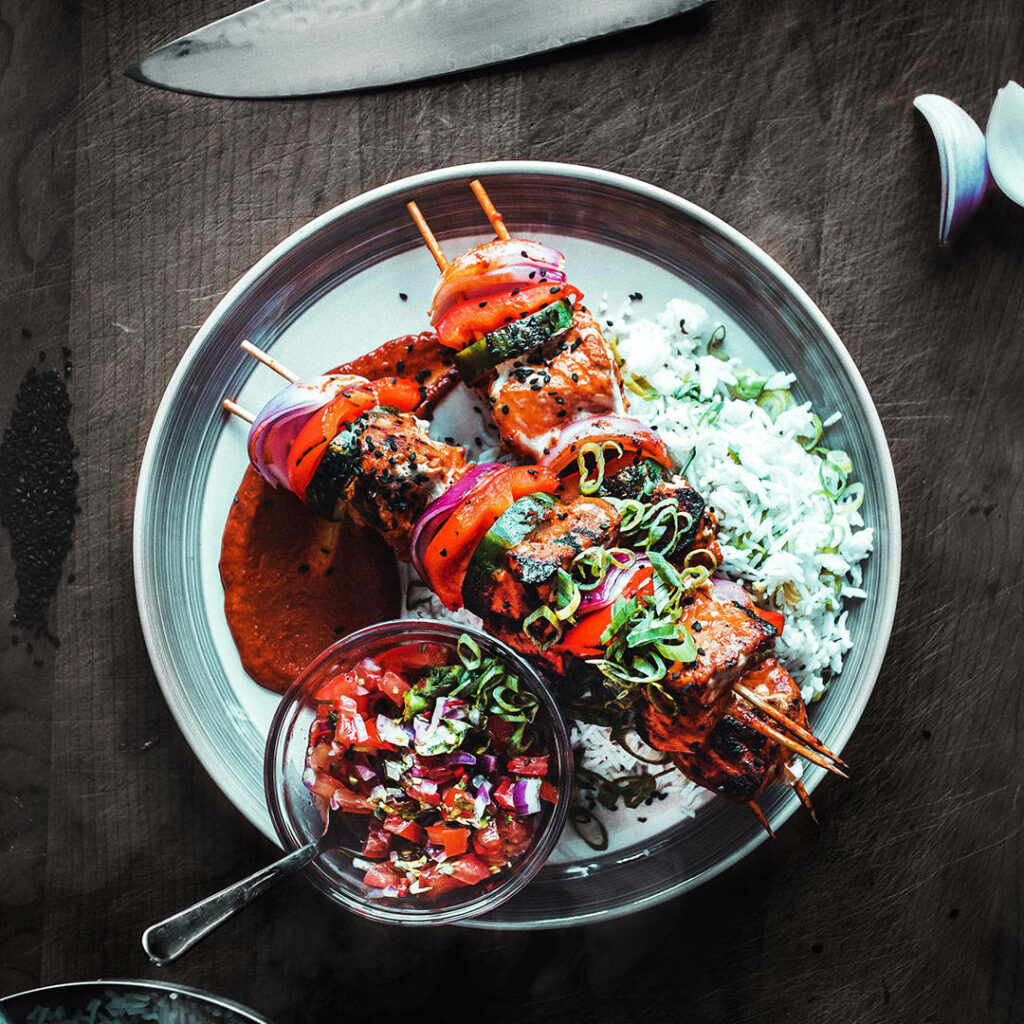 Delicious Tandoori Chicken Kebabs Wallpaper with Rice and Chutney