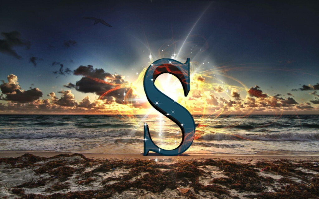 Serene Sunrise S: A Stunning Alphabet Wallpaper on a Sandy Beach