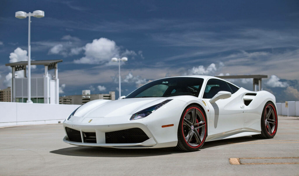 Roof-Top Stunner: Captivating White Ferrari Sports Car Shining in Sunlit Urban Landscape Wallpaper
