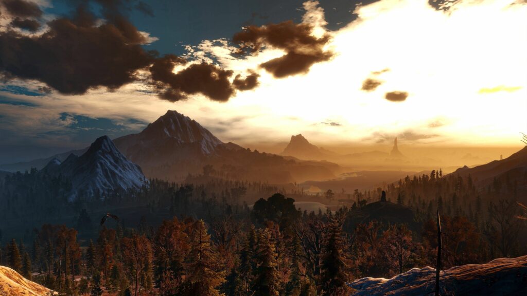 Breathtaking mountain landscape with autumn forest and warm sunlight under dramatic clouds Wallpaper
