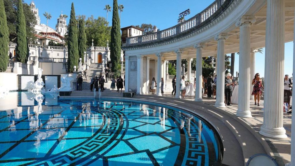 Hearst Castle Neptune Pool with blue water and neoclassical colonnade Greek key mosaic pattern Wallpaper