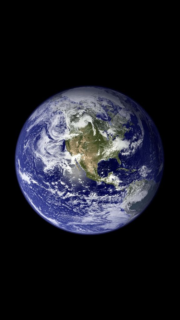 Realistic sunlit Earth wallpaper showing North America against deep black space background