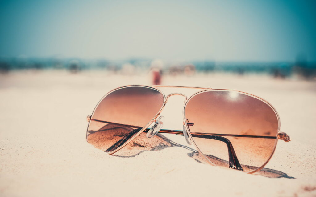 Summer Serenity: Sandy Beach Sunglasses HD Wallpaper