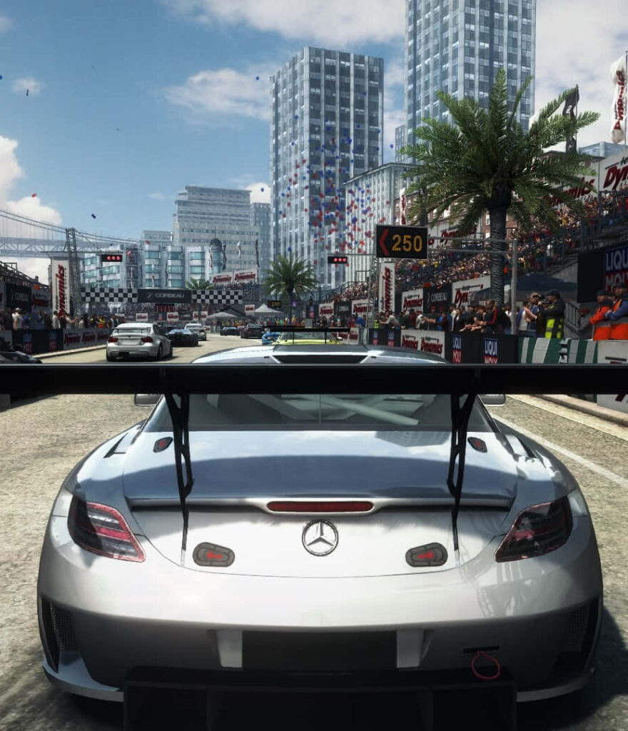 Sleek Gray Mercedes Speeding through a Sunny Grid Autosport Street Race Wallpaper