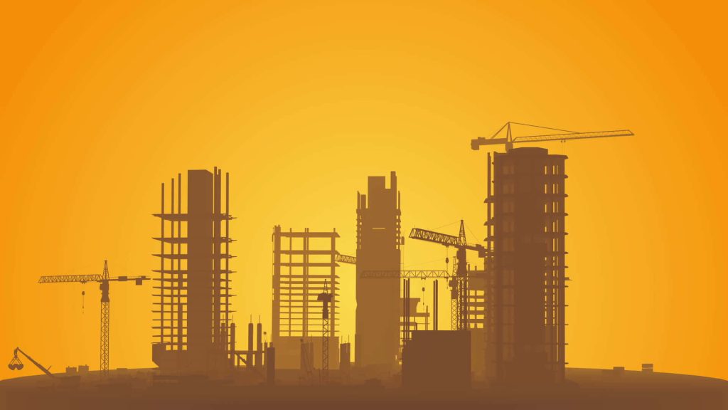 Silhouette of cranes and unfinished buildings at sunset construction site wallpaper background