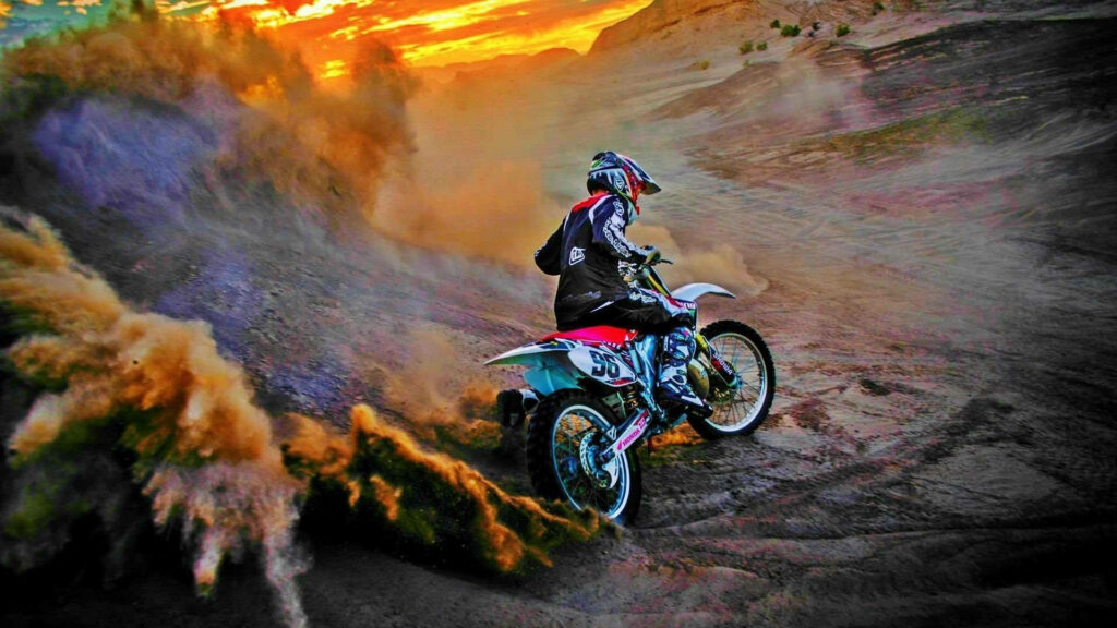 Dirt bike rider kicking up dust on rugged terrain at sunset vibrant off-road adventure background Wallpaper