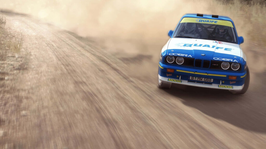 Rally Car Drifting on Dirt Track - Thrilling Wallpaper for Motorsport Fans